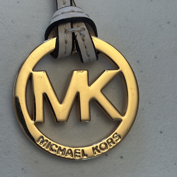 Michael Kors hang tag, gold with ivory leather strap. Approx 6” x 1.75” - Picture 5 of 5